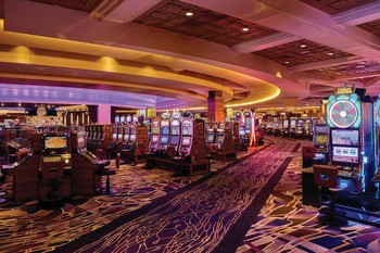A woman is suing the MGM Grand Detroit for refusing to pay a $127,000 progressive blackjack jackpot