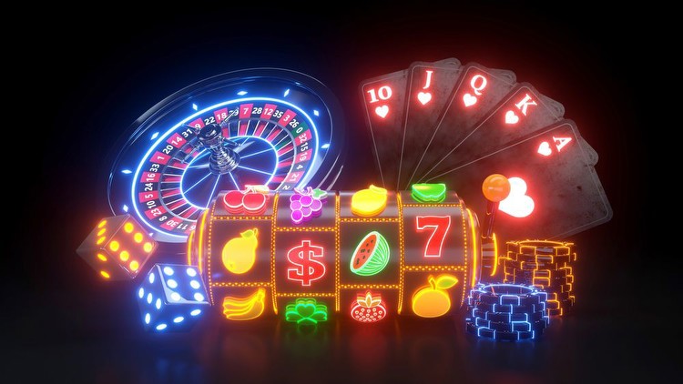 Slot machine with fruit symbols, roulette wheel, king, queen, jack & ace cards in neon